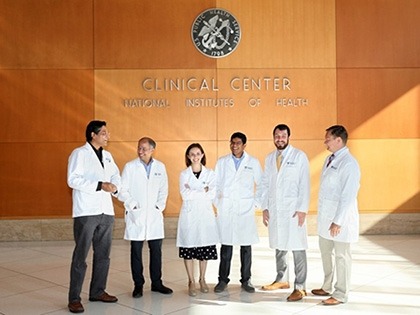 group of people in white coats standing together