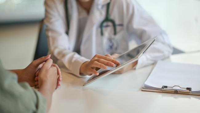 a doctor and patient talking together