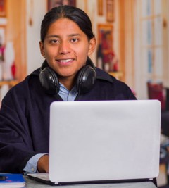 A Native youth working on their laptop