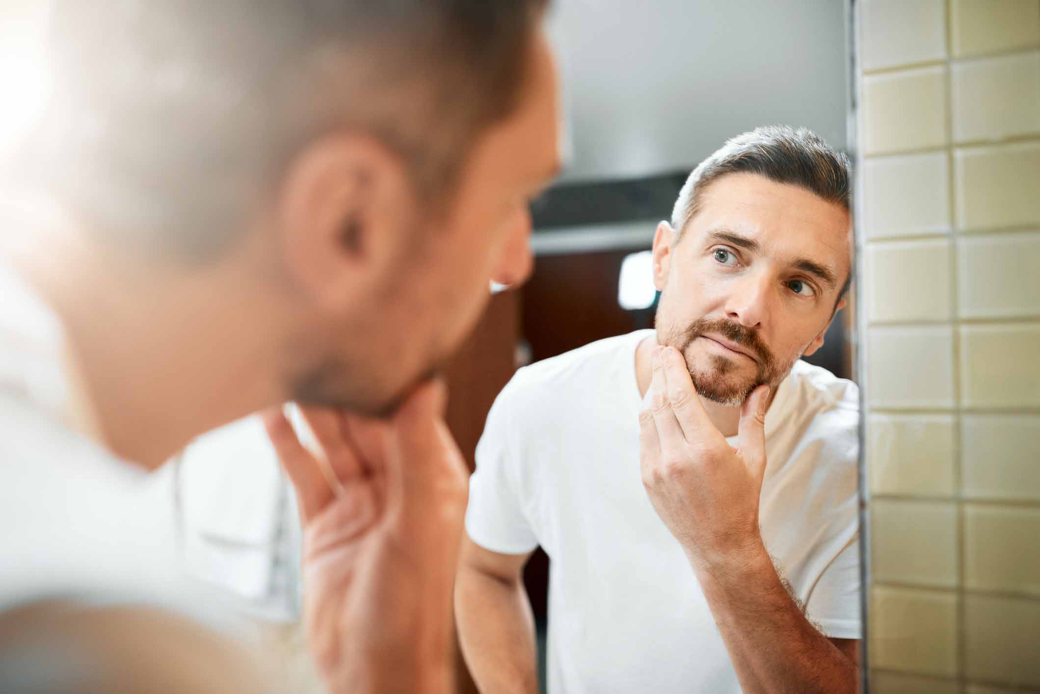 A man looking in the mirror