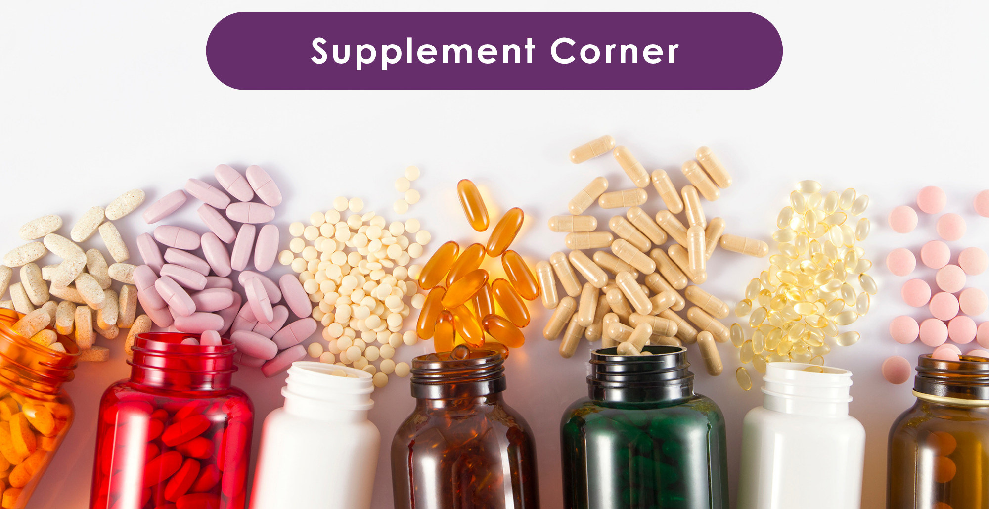 Photograph showing seven open supplement bottles in various colors with different types of pills and capsules spilling out, arranged in a row under a purple label reading 