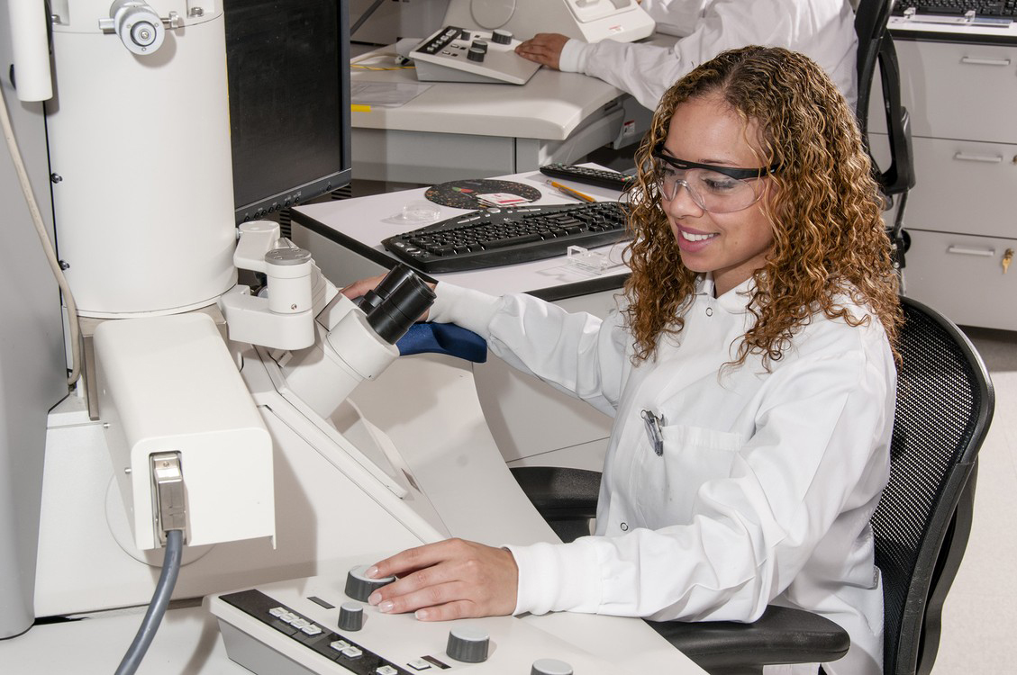 Technician using an Electron Microscope
