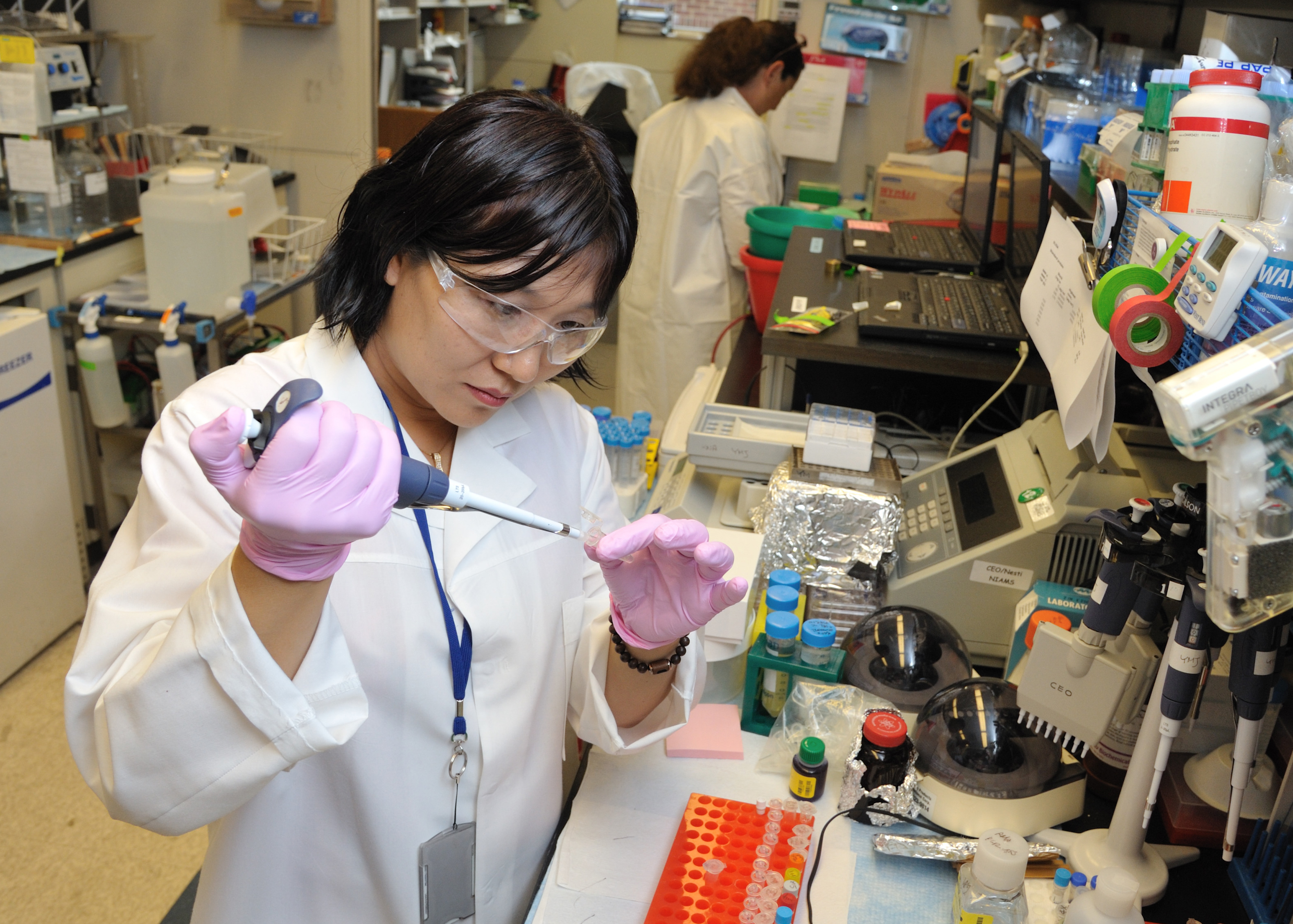 Research fellow conducting research in a lab