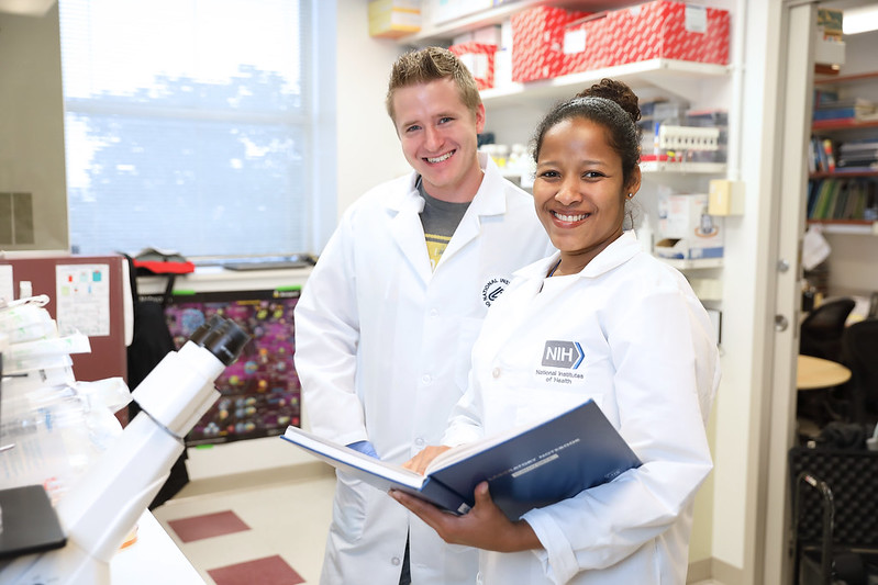 Two researchers smiling