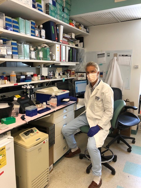 researcher sitting in a lab