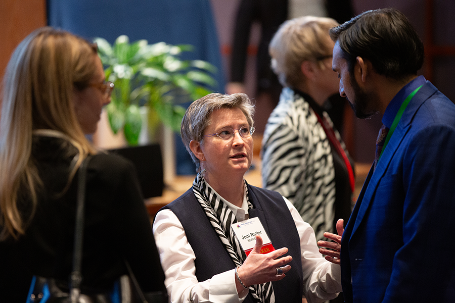NCATS Director Joni L. Rutter, Ph.D. talking with Rare Disease Day at NIH attendees.
