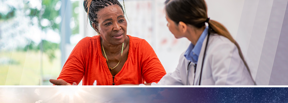 Decorative. African American middle age woman talking to medical professional