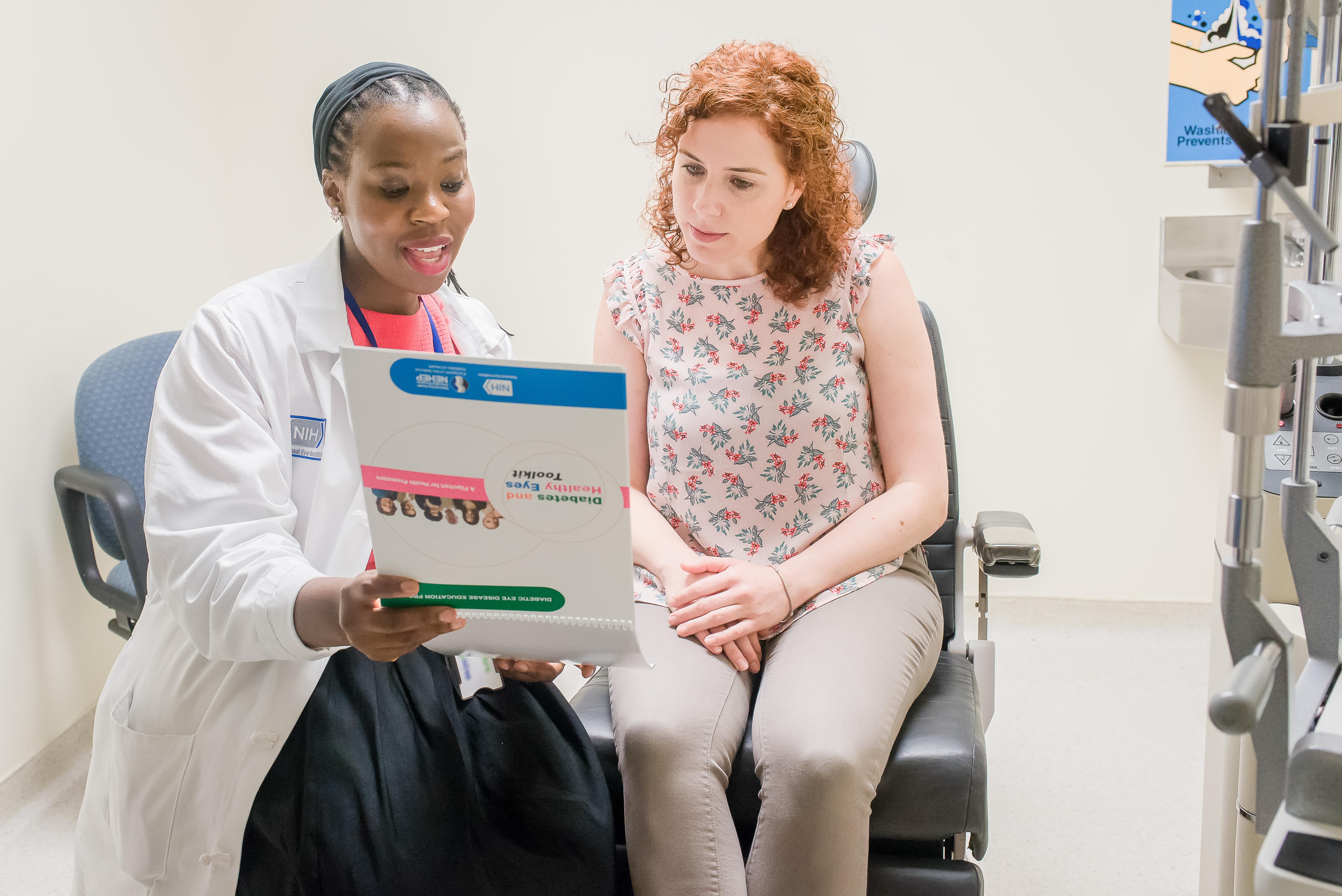 a doctor talks with a patient about eye disease