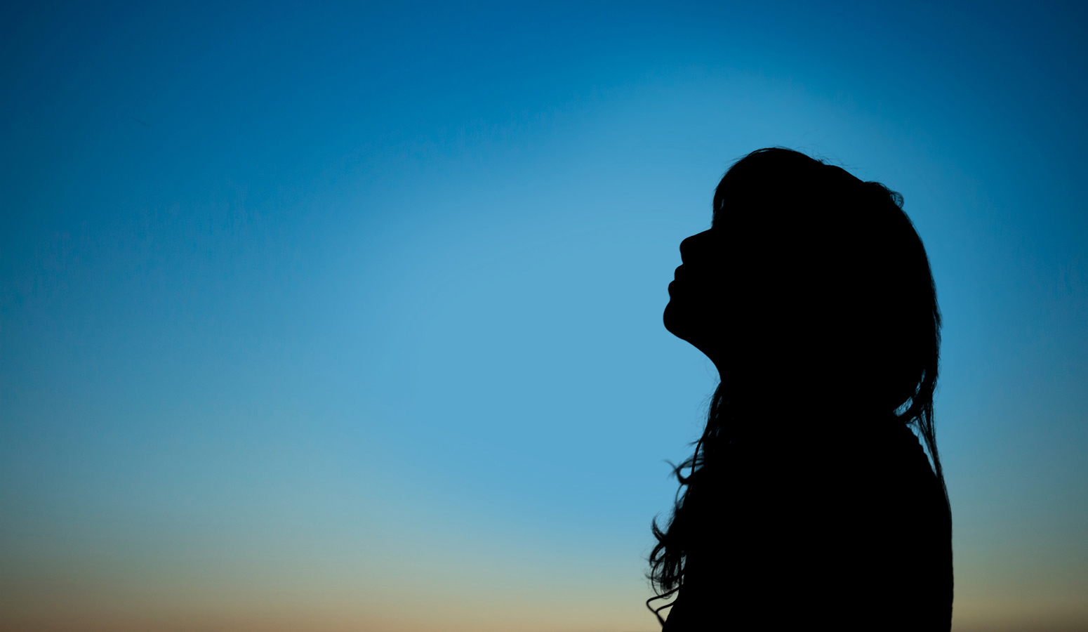 woman looking up to the sky