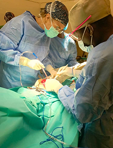 Dr. Hannah Wild and Colonel Bassinga in the operating room