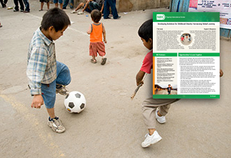 two boys playing with a soccer ball
