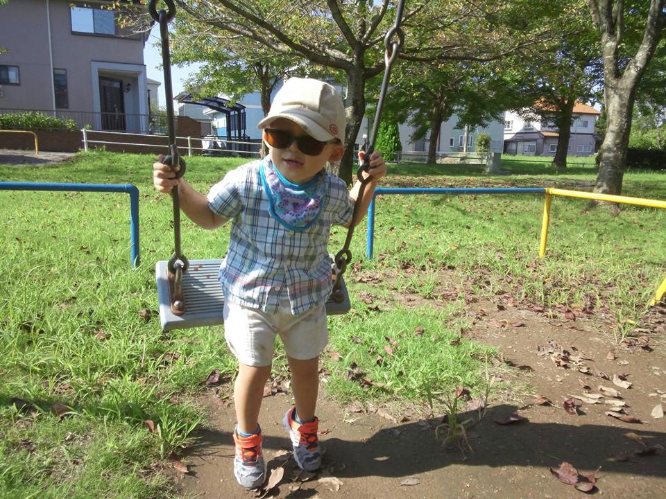 GRDR boy playing on swing