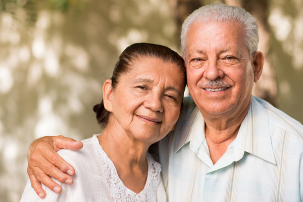 Older Hispanic couple smiling