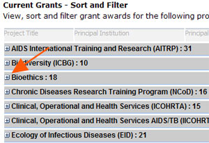 screen capture of clicking plus to expand list of grant awards for a program