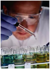 Chemist using a dropper
