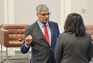 Jay Bhattacharya speaks with scientist after talk