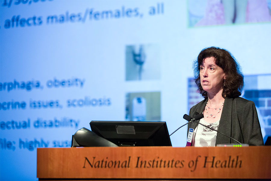  Theresa Strong speaking at a lectern.