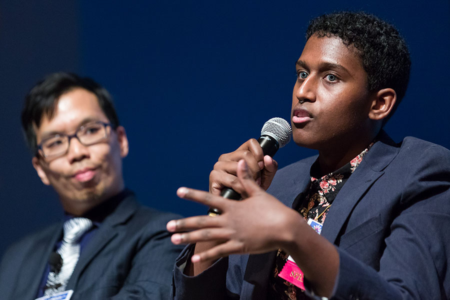 Eric Wk Sid and Taj Neaz Powell participating on a panel.