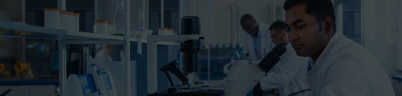 Research scientist looking in a microscope