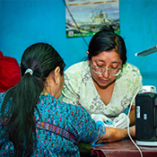 Community health worker provides care for hypertensive patient in Guatemala courtesy of Sean Duffy