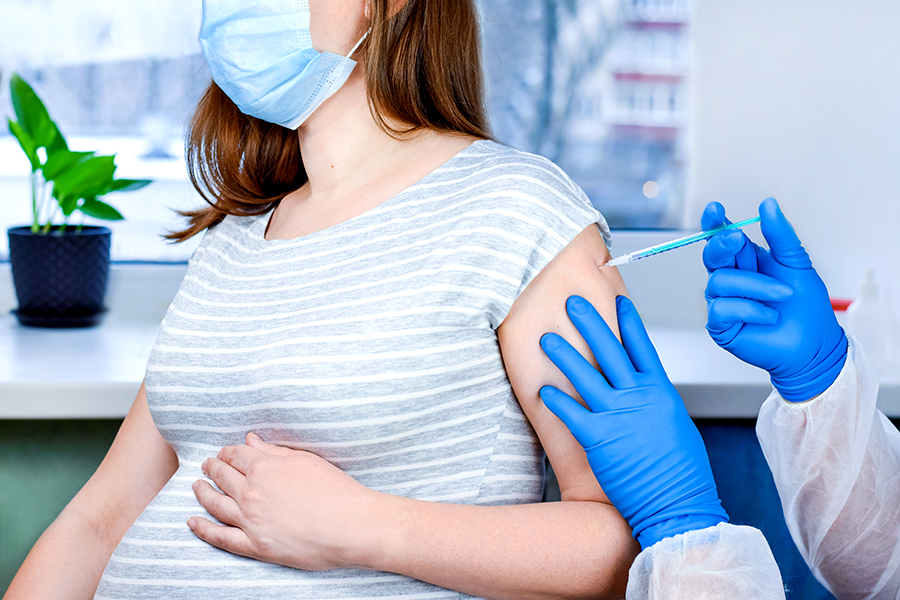 Doctor giving vaccination shot.