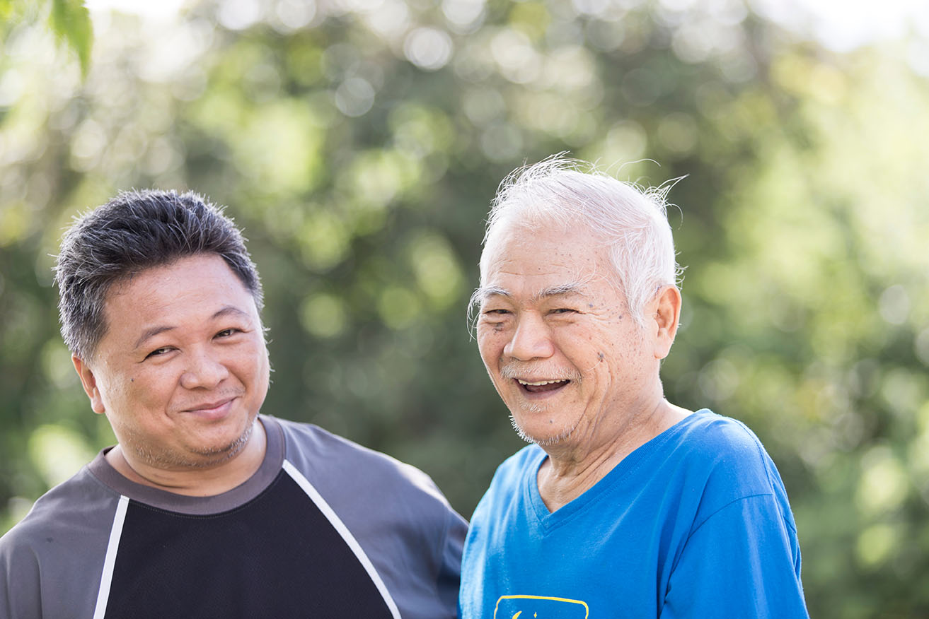 Decorative. Middle aged asian man with elderly father