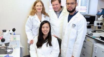 group of people in white lab coats
