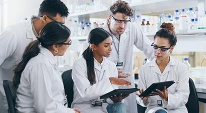group of people in white lab coats