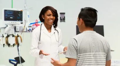 doctor talking with patient in exam room