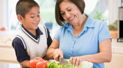 Grandmother And Grandson Preparing meal,mealtime Together