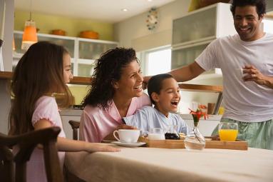 a family enjoying breakfast together.