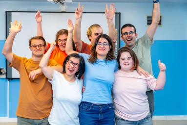 photo of a group of people, several showing signs of Down Syndrome
