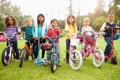 a group of children riding bicycles