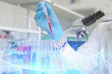 dna helix overlayed on a photo of a scientist in a lab